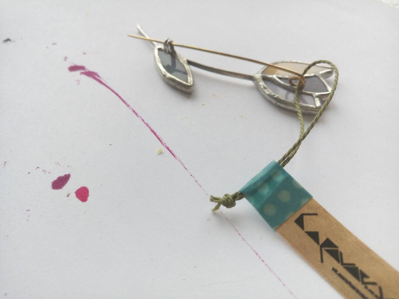 Glass tulip brooch with metal pin backing