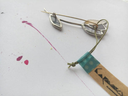 Back side of stained glass tulip brooch showing secure pin clasp handmade jewelry detail