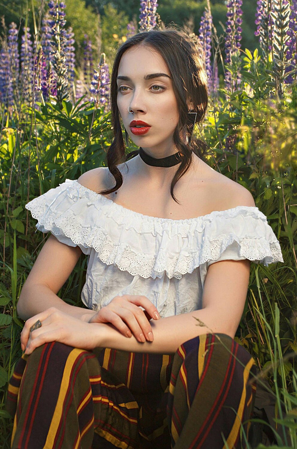 Model outdoors wearing black stained glass triangle choker and matching earrings.