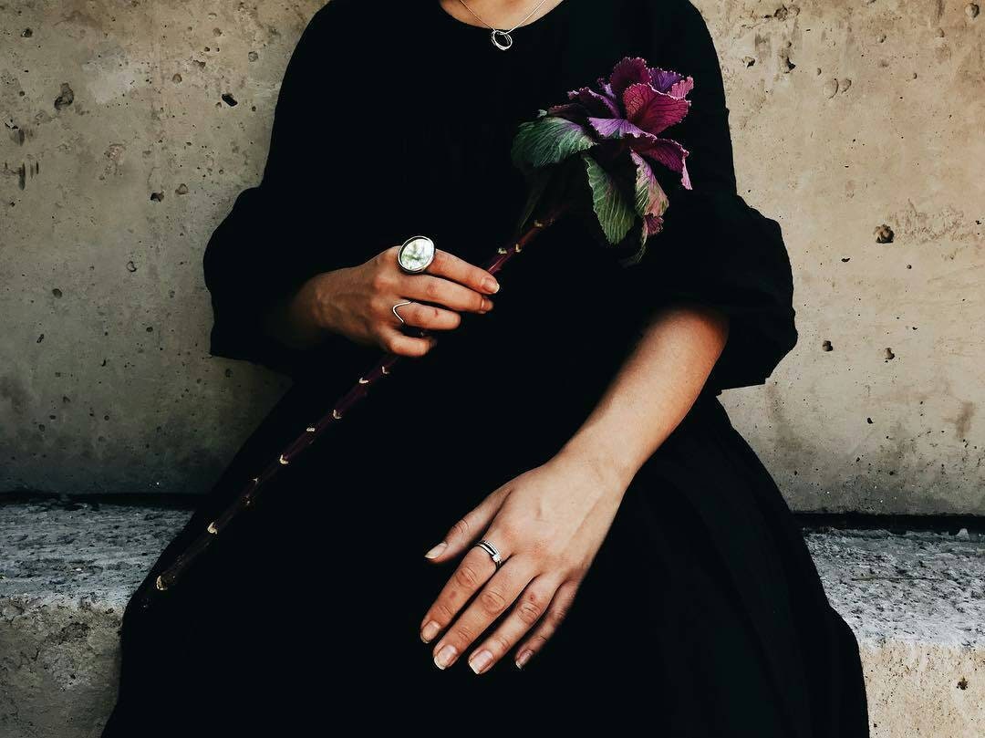 Chunky mirror ring styled with black dress