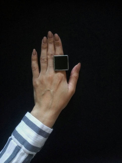 bold geometric black ring detail