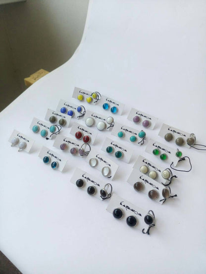 Assorted stained glass earrings in multiple colors on cards