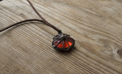Close-up of reflective glass pendant glowing in sunlight