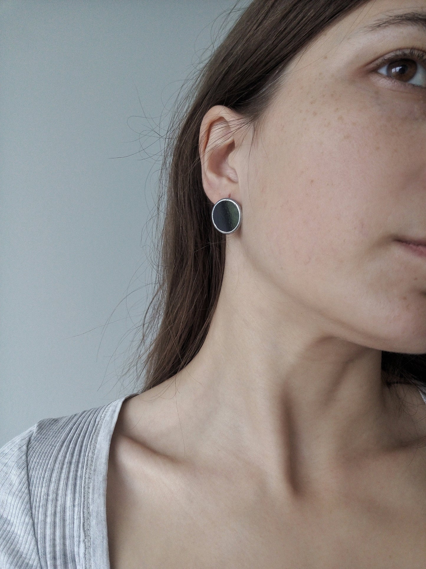 Minimalist black round earrings geometric silver disc on model