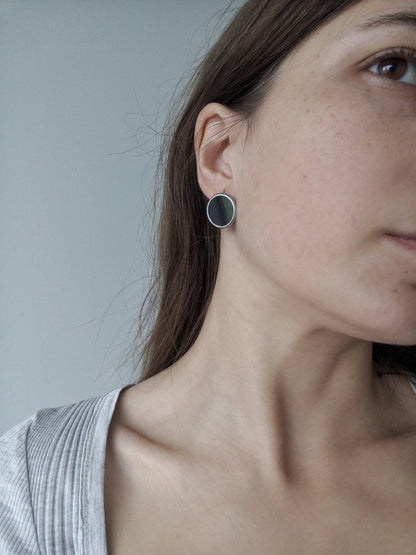 Minimalist black round earrings geometric silver disc on model