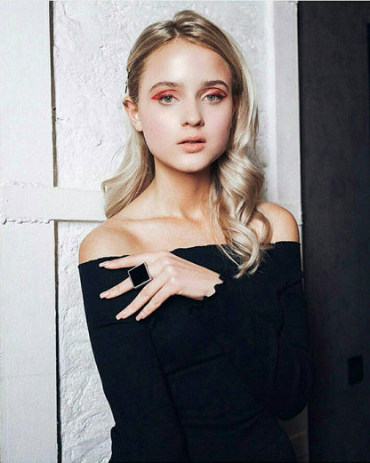 modern black glass ring worn on model
