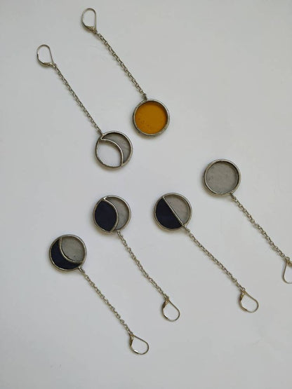 Yellow sun stained glass dangle earring close up