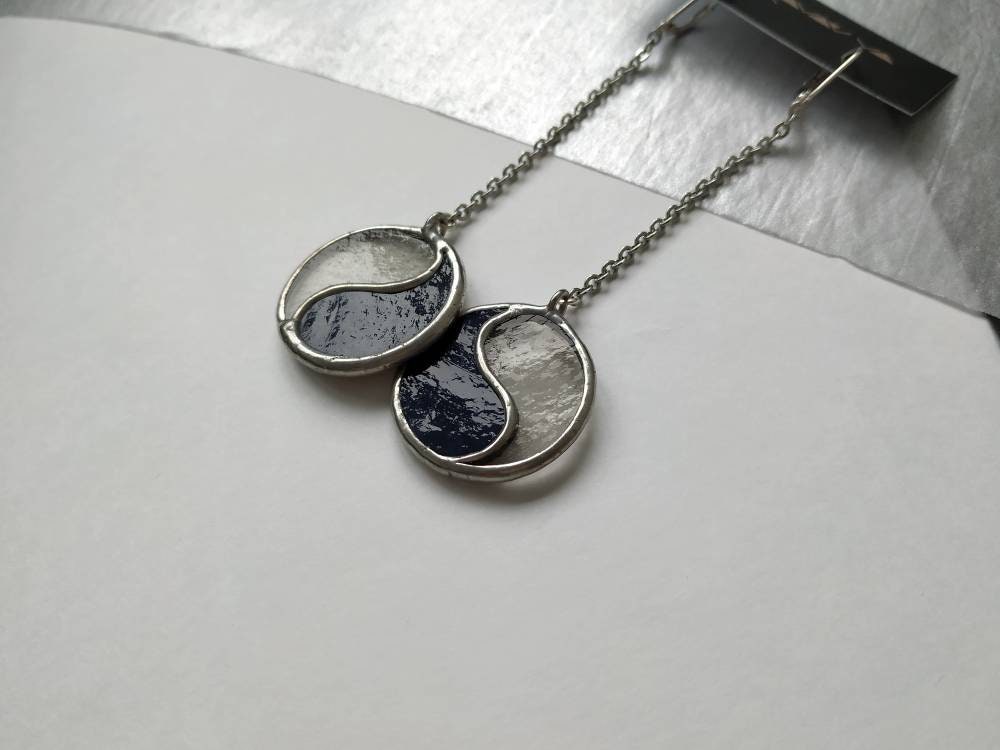 Minimalist black and white Yin Yang earrings close up