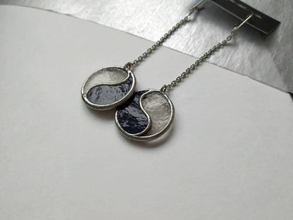 Minimalist black and white Yin Yang earrings close up