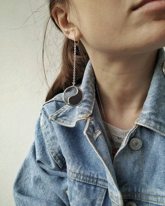 Yin Yang dangle earrings worn on model minimalist style