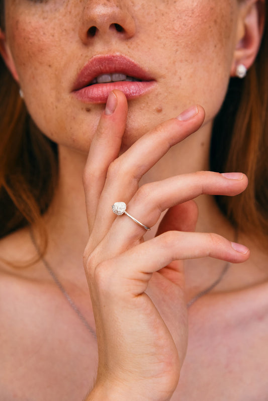 Minimalist textured silver ball ring worn on woman’s hand, handmade 925 sterling silver jewelry