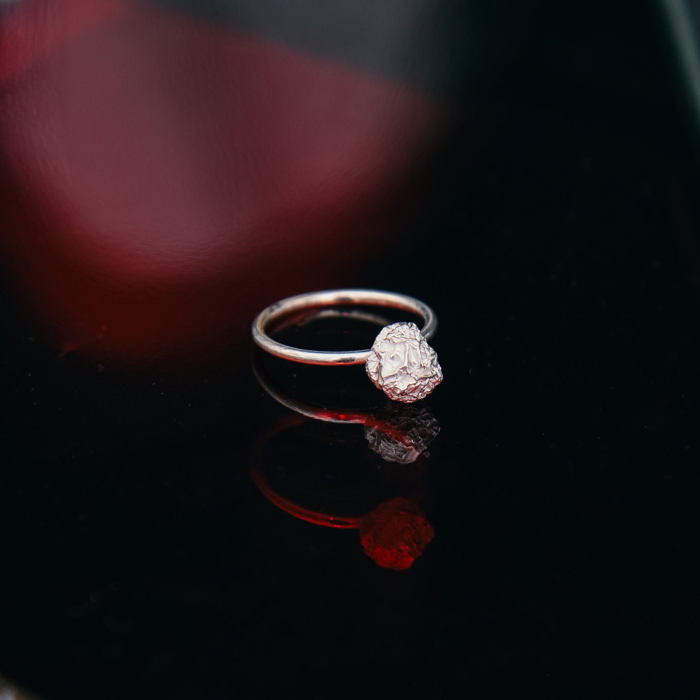 Minimalist 925 sterling silver textured ball ring on black background