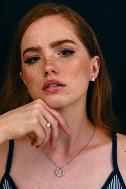 Model with a ball ring on a finger - unique women gift jewelry.