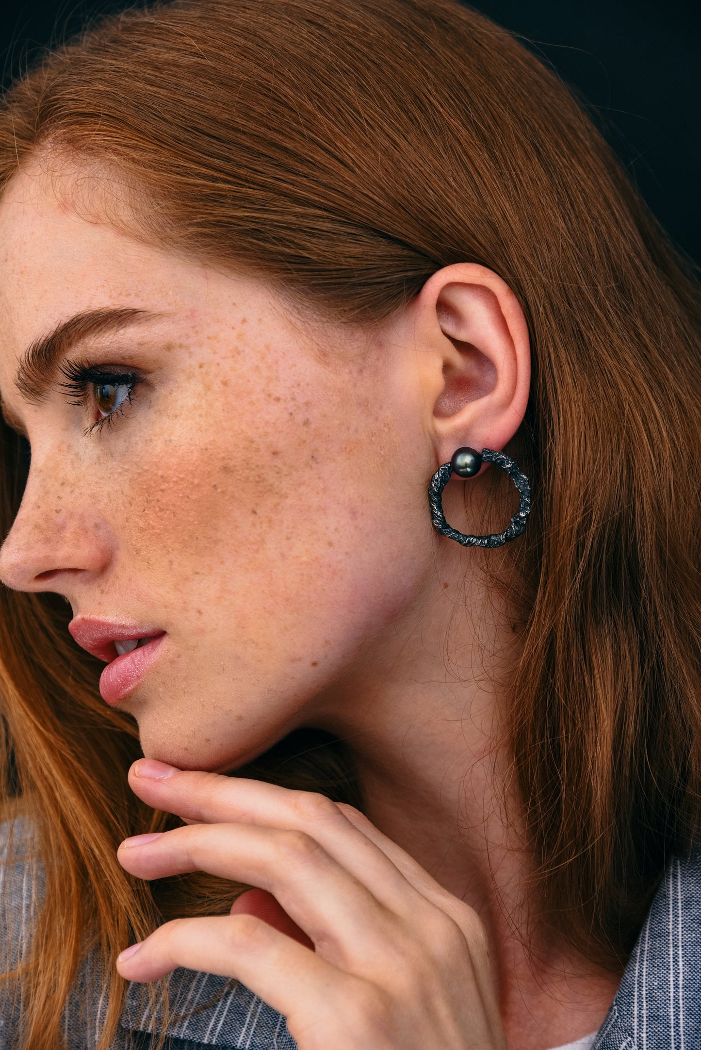 Dark silver hoops on model close-up