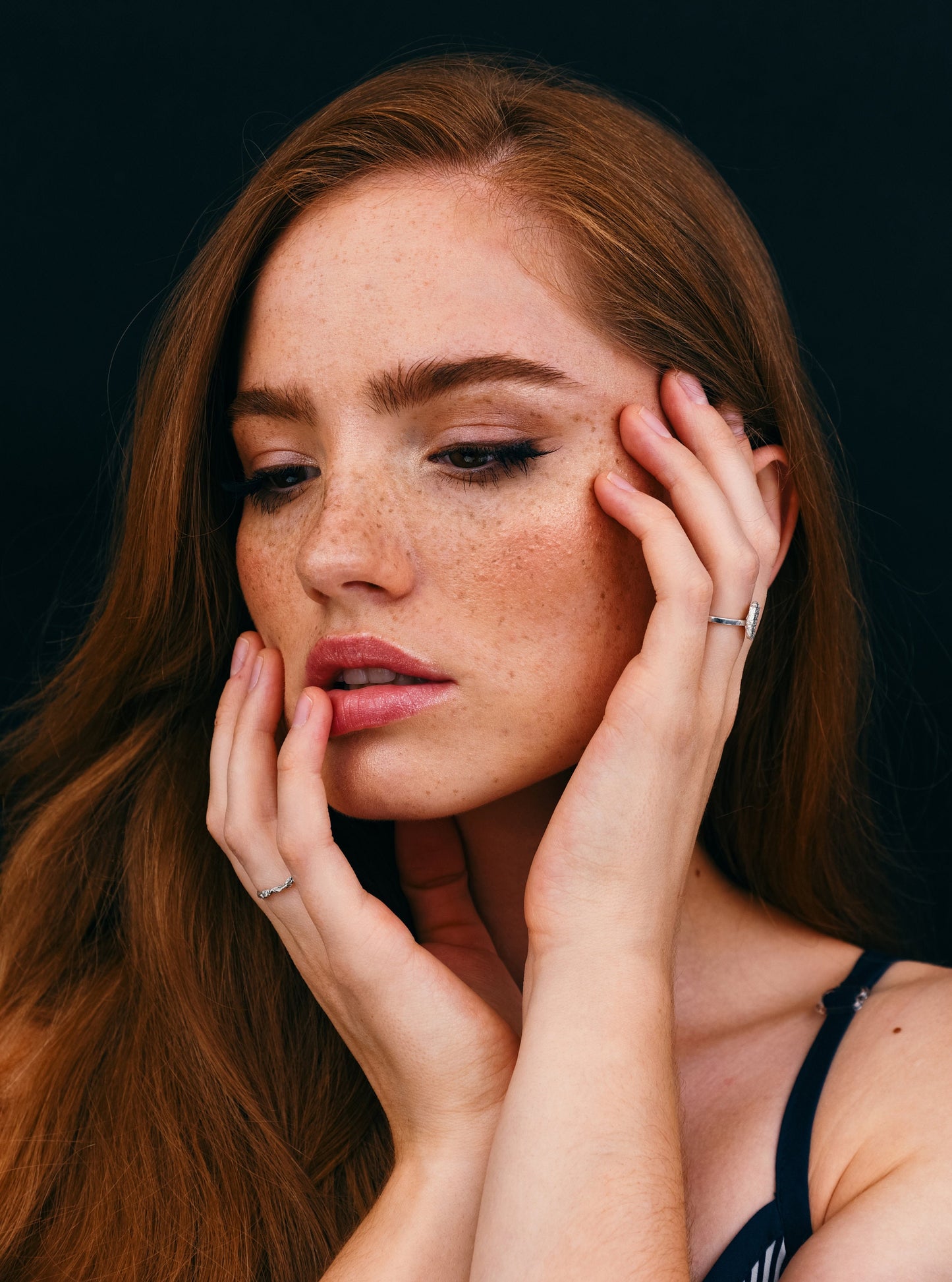 Textured silver statement ring on model, contemporary women’s jewelry