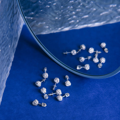 Everyday silver studs photographed in natural light..
