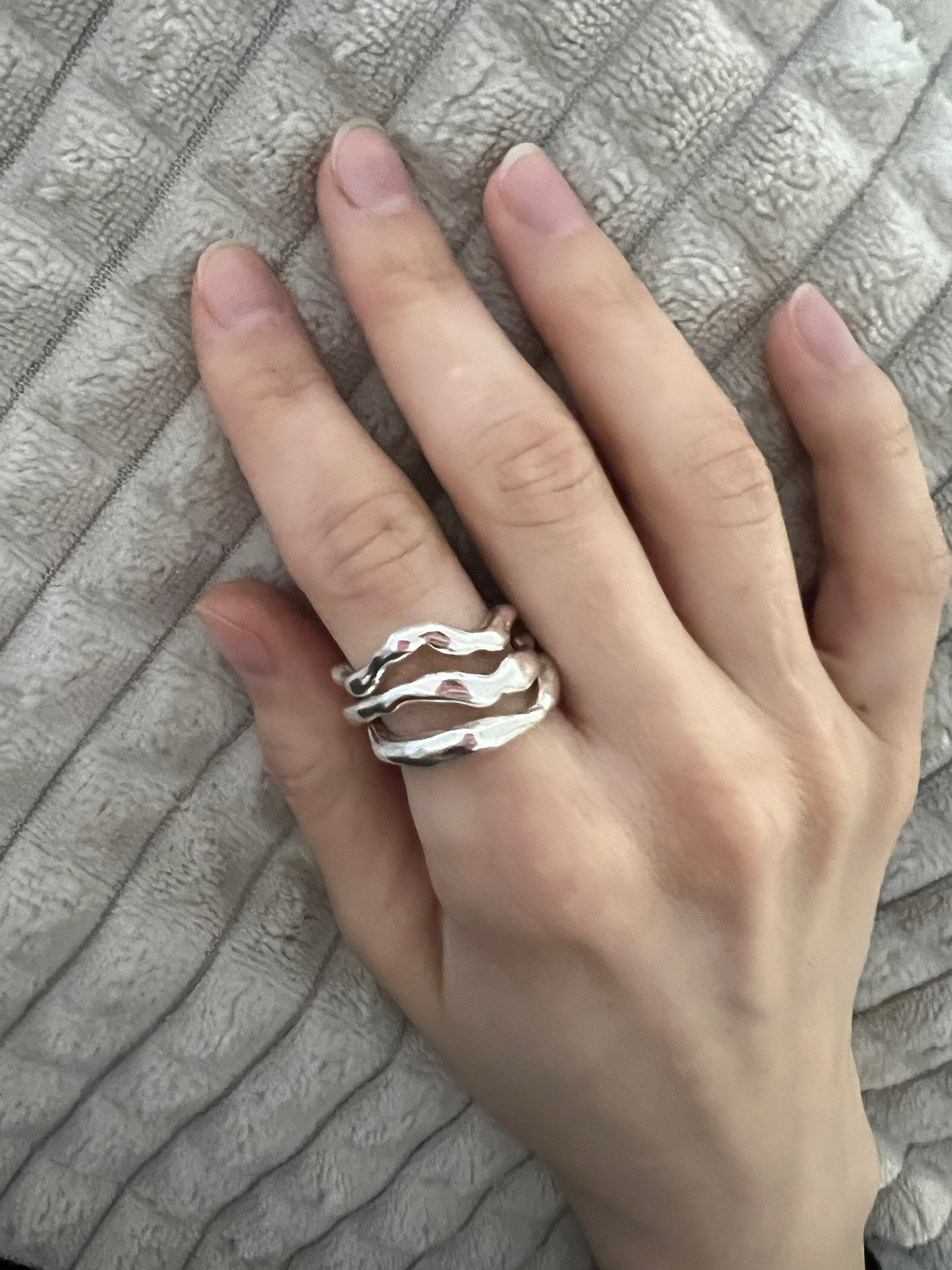 Silver wave ring stack on hand, liquid metal modern jewelry