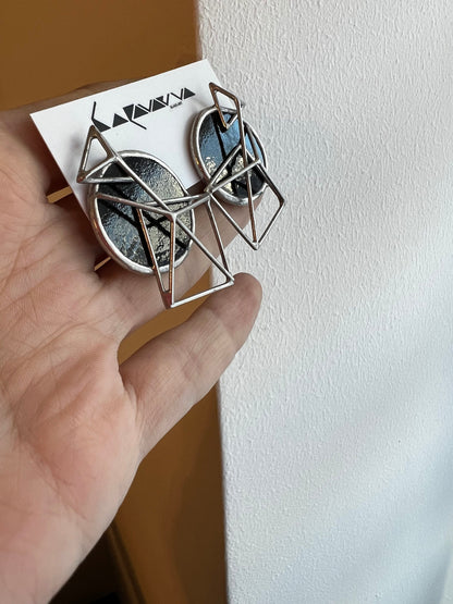 Large black disc earrings with angular pyramid wire design