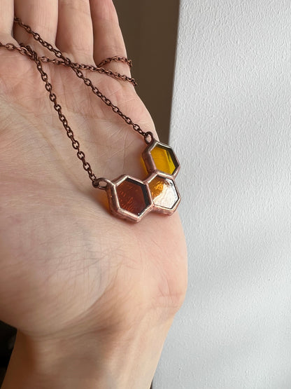 Copper honeycomb necklace with warm yellow glass