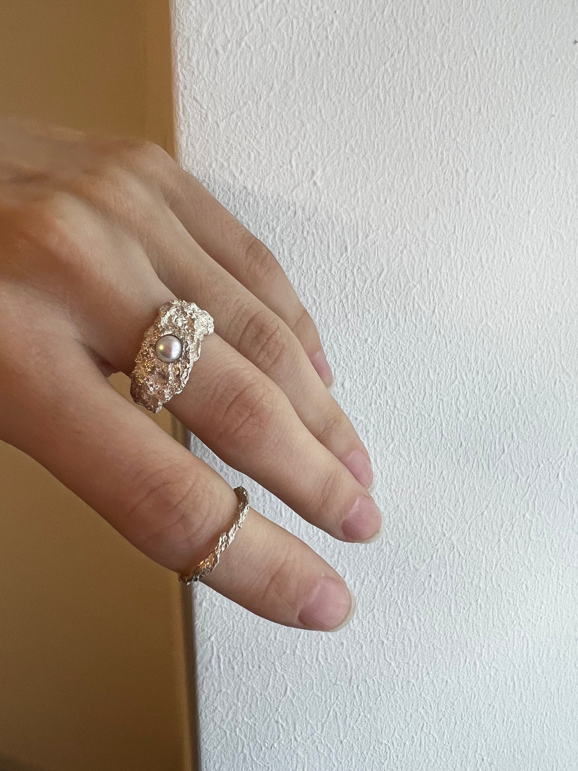 Modern sterling silver ring with organic texture and pearl