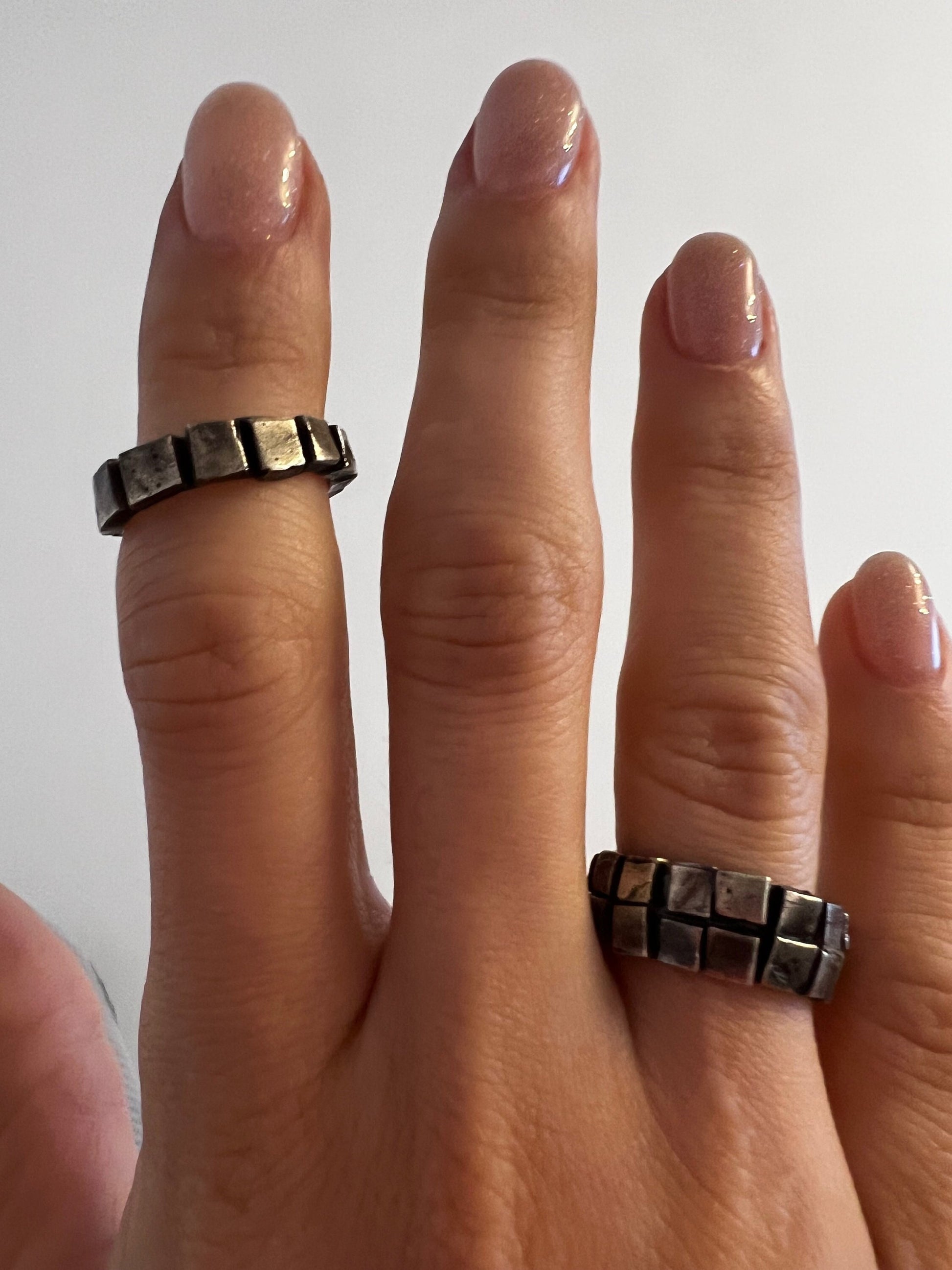 Black oxidized silver ring close-up – geometric brutalist jewelry
