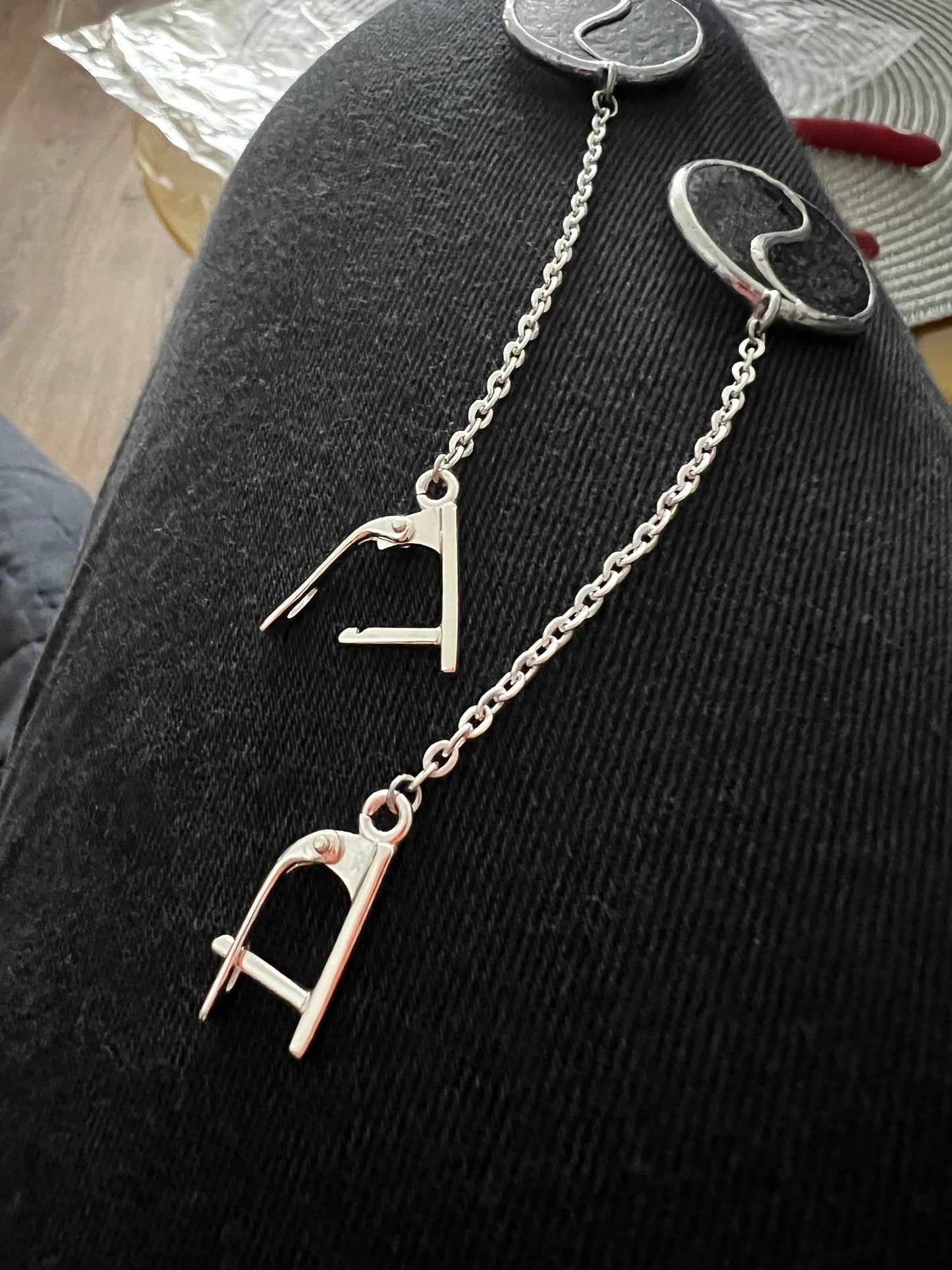 Yin Yang earrings hanging on stainless steel chain