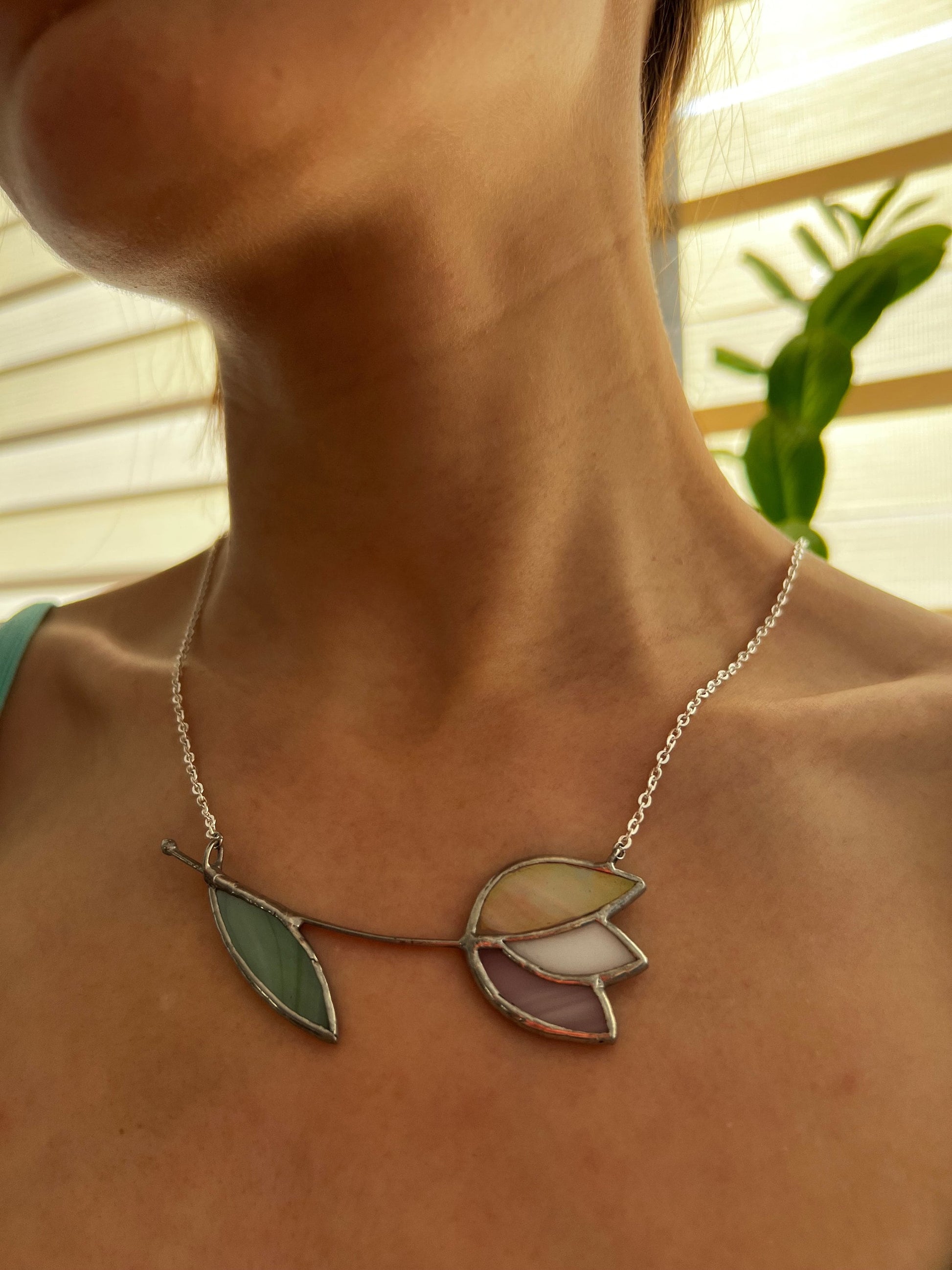 Milky white stained glass tulip necklace with light green leaf. Delicate handmade floral pendant on silver chain.