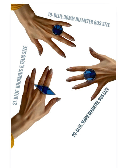 blue and silver bold rings on model hands