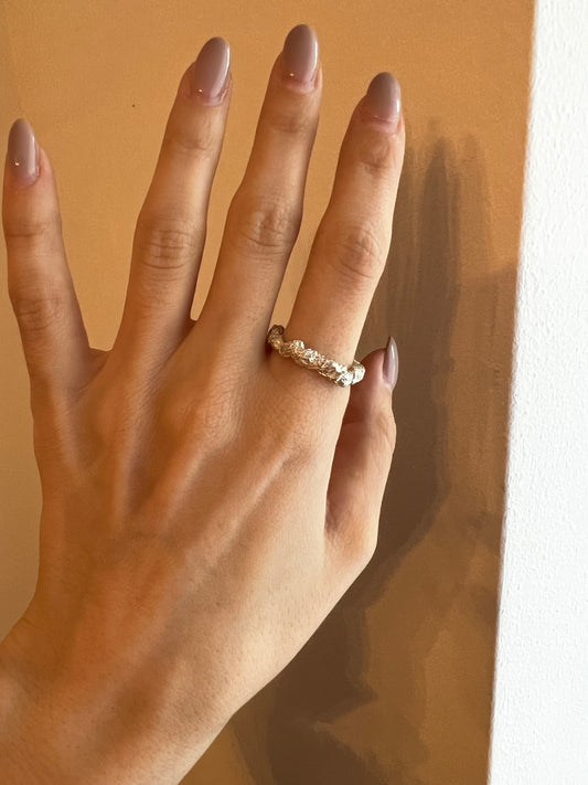 Photo of a ring on a hand — Sterling silver textured ring on hand, unique crumpled band jewelry for women.