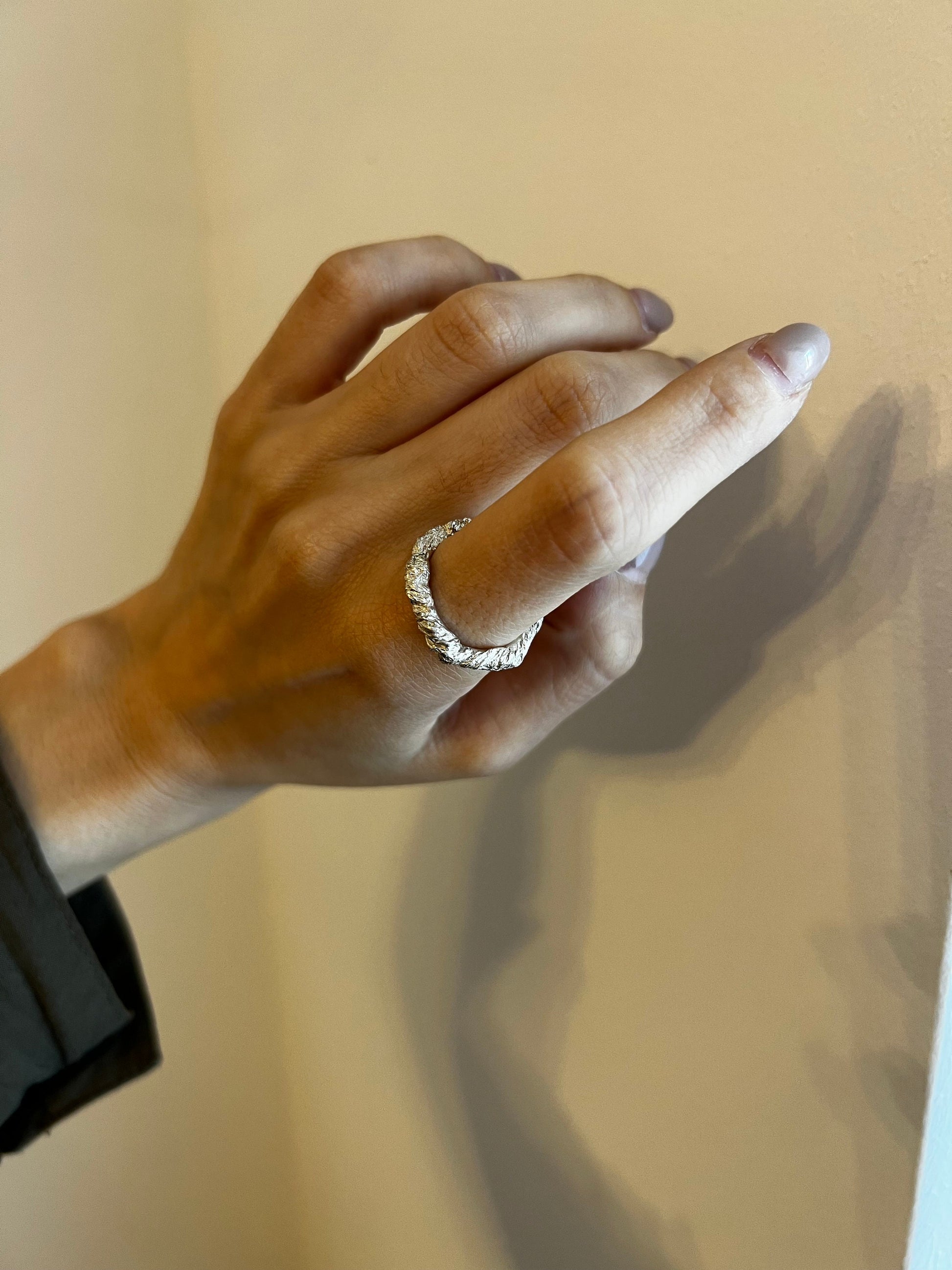 Ring in hand — Sterling silver 925 textured band ring, artisan hammered jewelry.