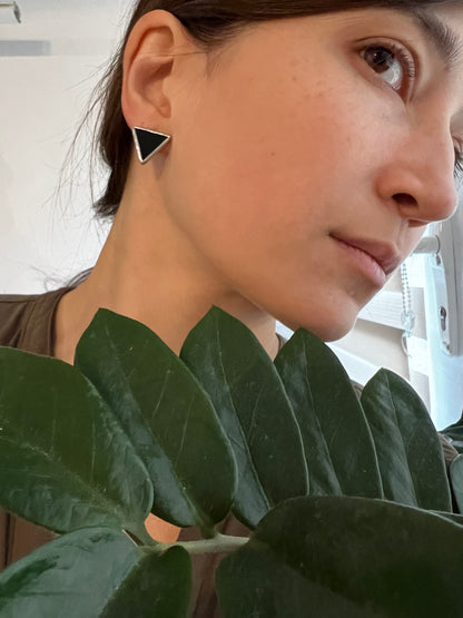 Geometric black earrings small triangle studs side view
