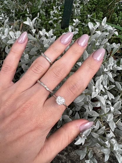 Set of thin silver rings for everyday wear.