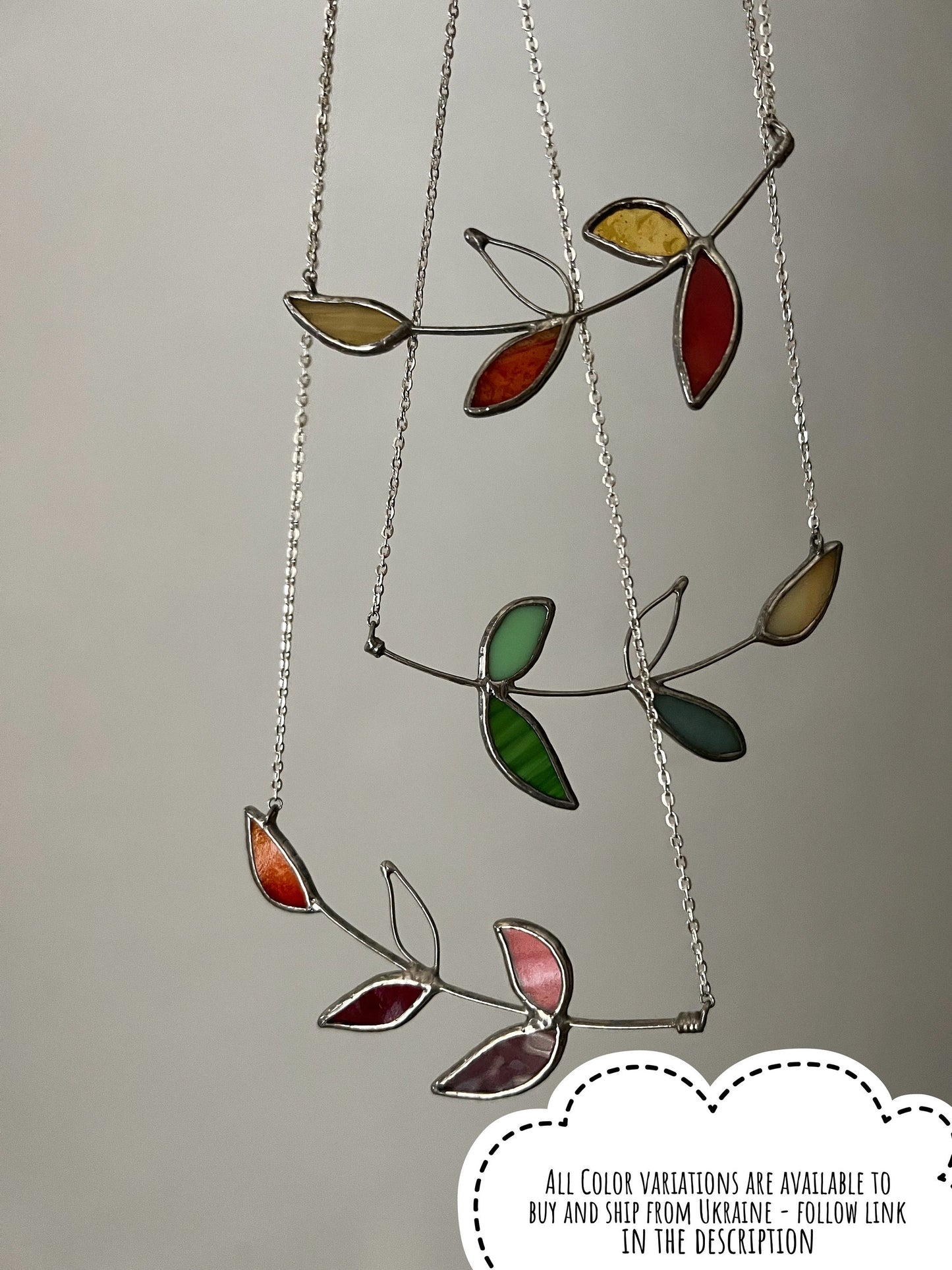 Multicolor stained glass necklace with tropical leaves in green, yellow and red. Colorful handmade nature pendant.