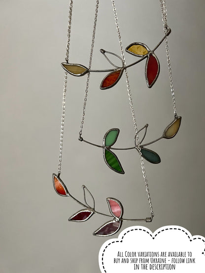 Multicolor stained glass necklace with tropical leaves in green, yellow and red. Colorful handmade nature pendant.