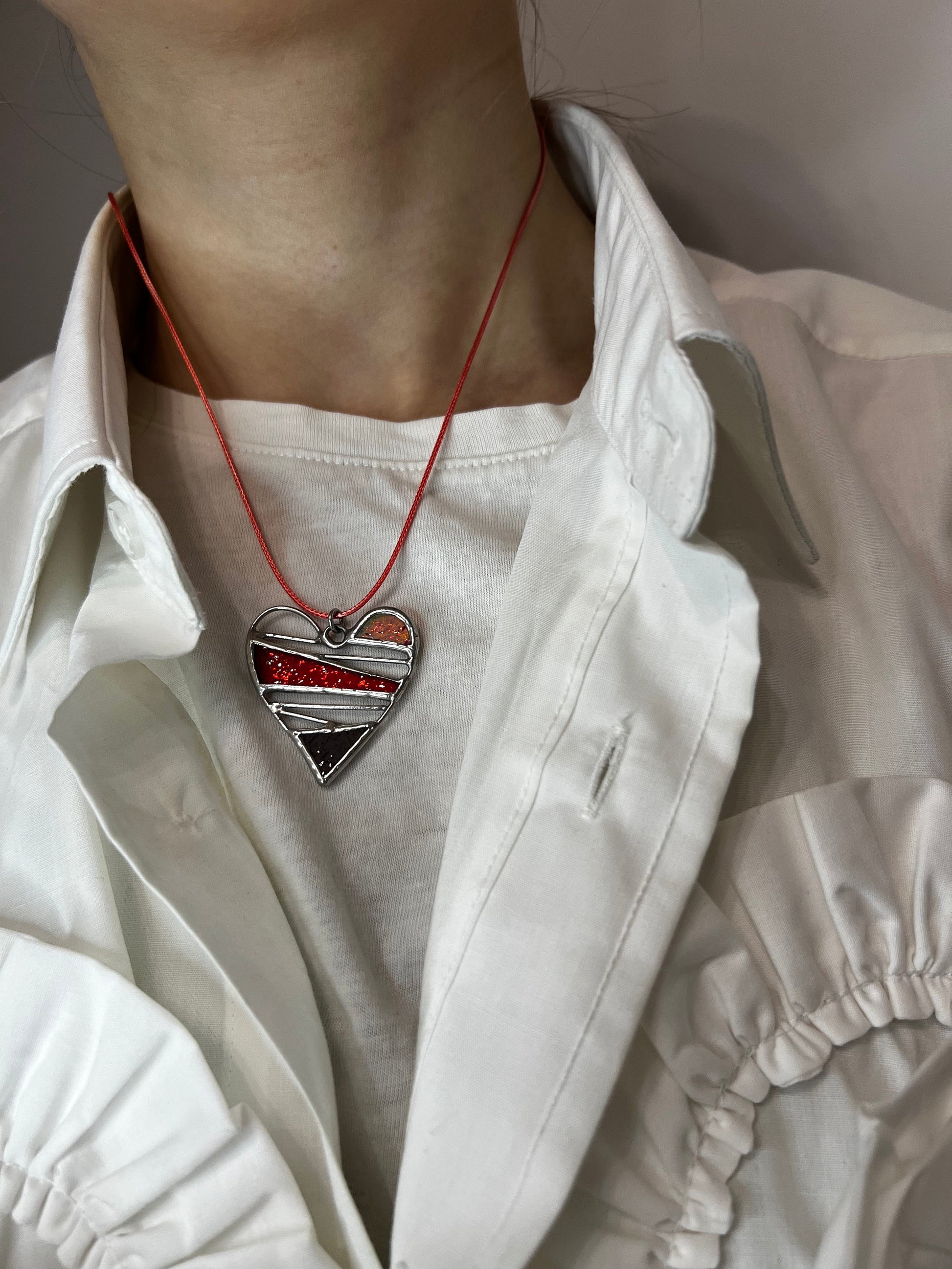 Valentine stained glass heart necklace worn close to the heart