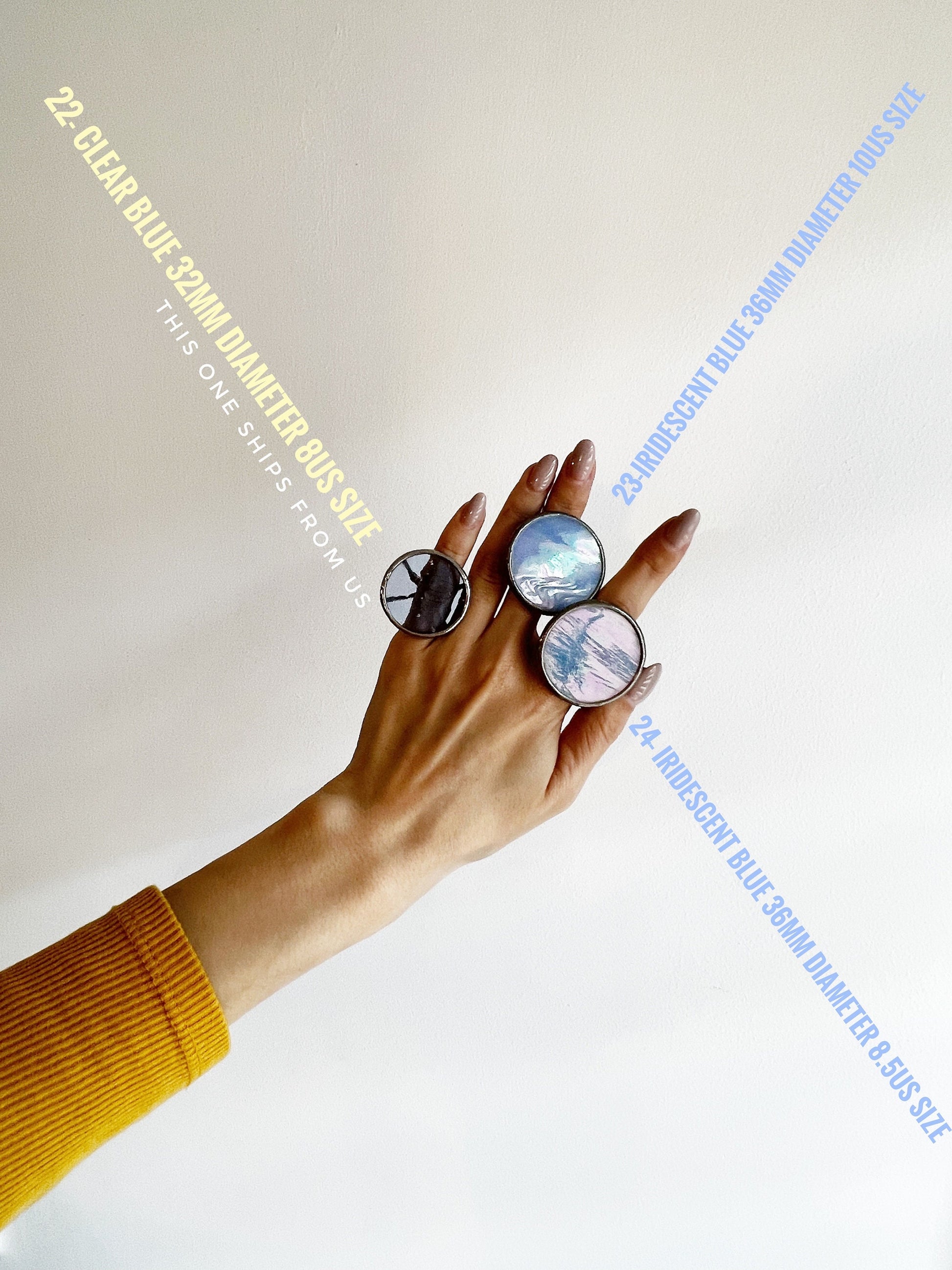 large disc rings artistic hand pose