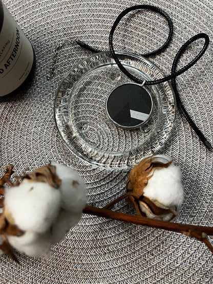 Necklace and cotton branches flat lay