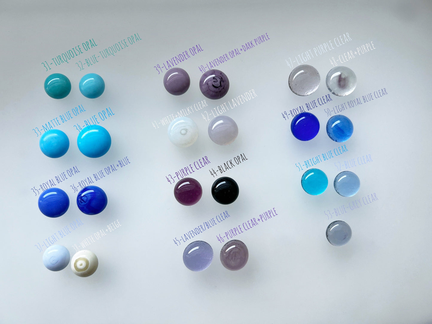 Selection of blue, gray and black glass cabochons for pendants