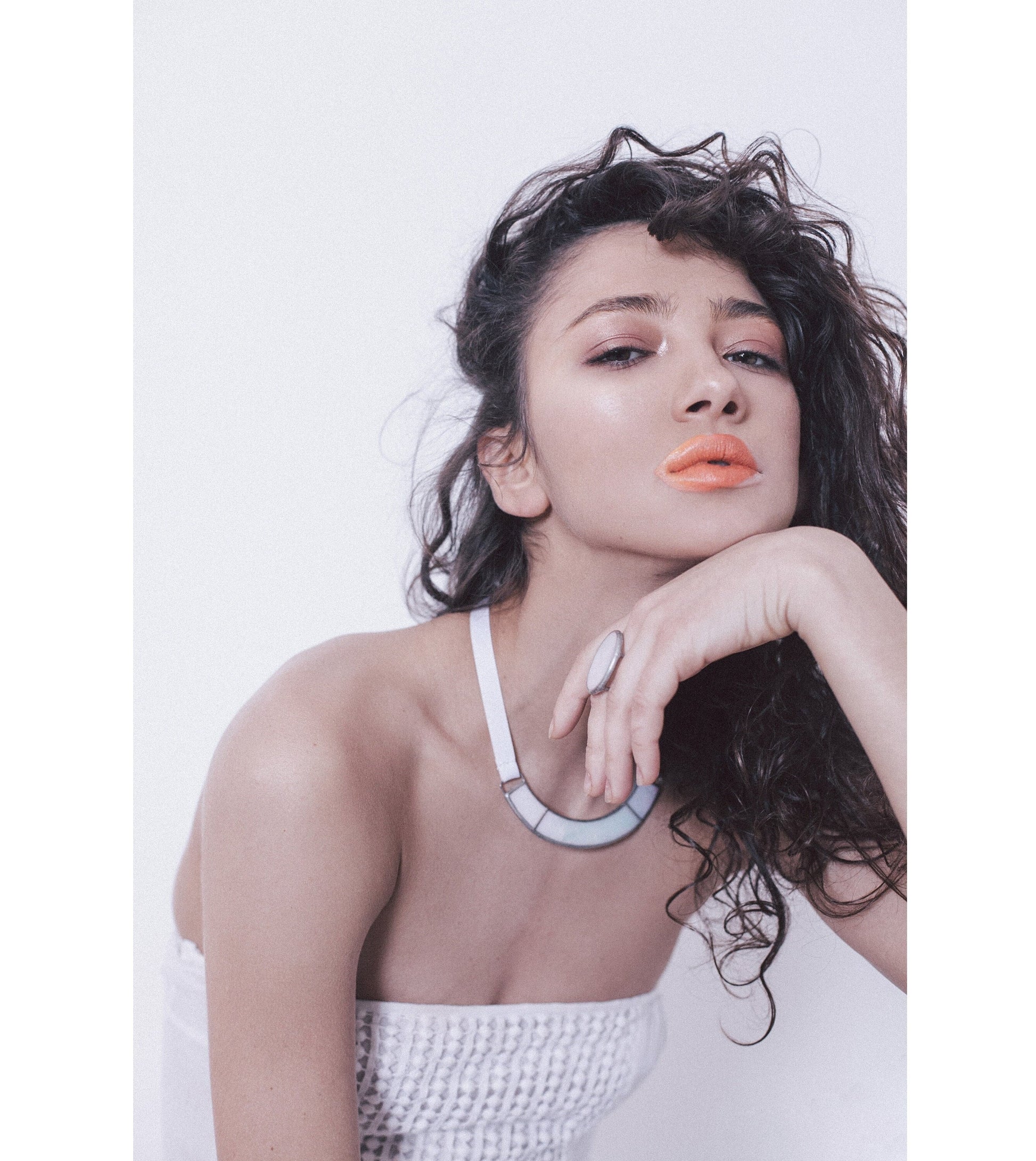 Model wearing iridescent chevron necklace – modern minimalist jewelry