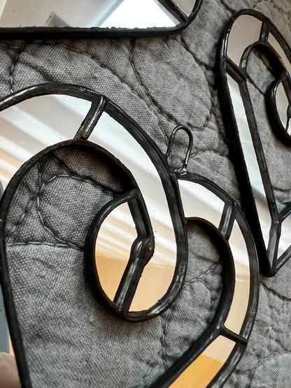 Mirror glass heart suncatcher reflecting light
