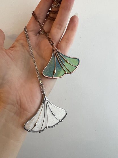 Green stained glass ginkgo leaf necklace on chain – close-up