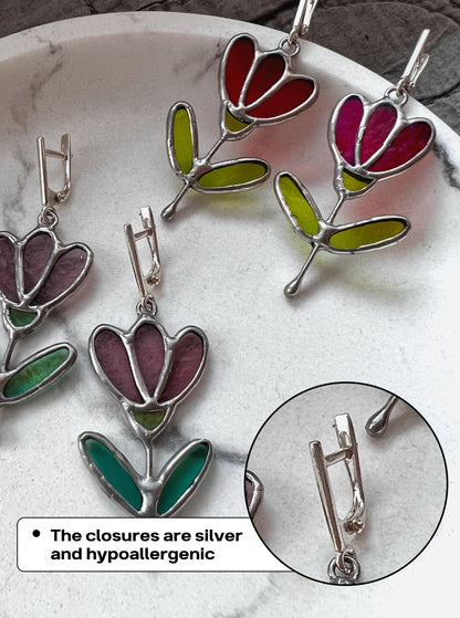 Botanical red and green stained glass flower earrings close-up
