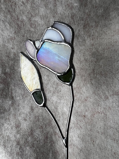 Glass magnolia with opal and yellow petals reflecting natural light