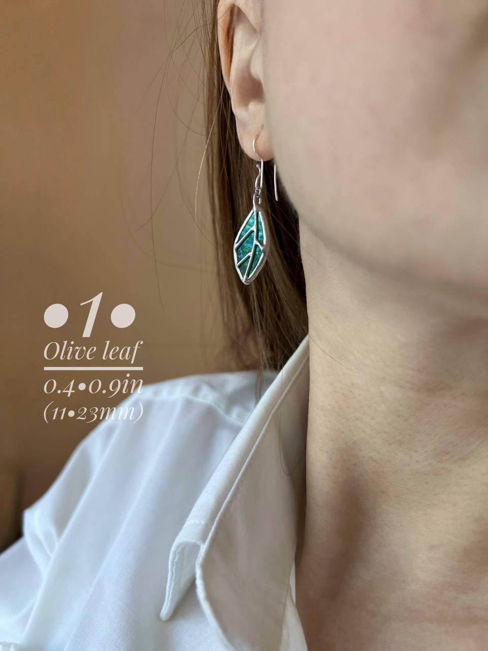 Stained glass birch leaf earrings worn on ear, sterling silver dangle jewelry