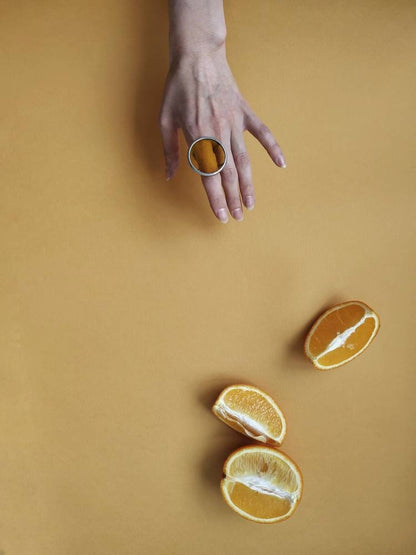 Yellow stained glass ring on hand, bold chunky circle design