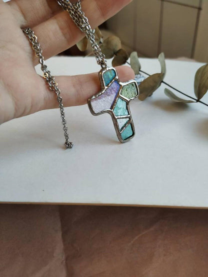 Detailed view of blue geometric stained glass cross necklace