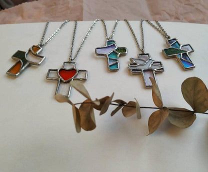 Artistic display of multiple crosses necklaces with dried branch decor