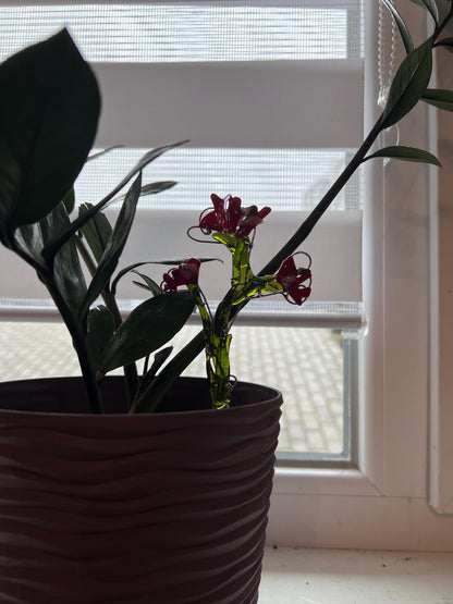 Eco-friendly fused glass flower placed inside a plant pot