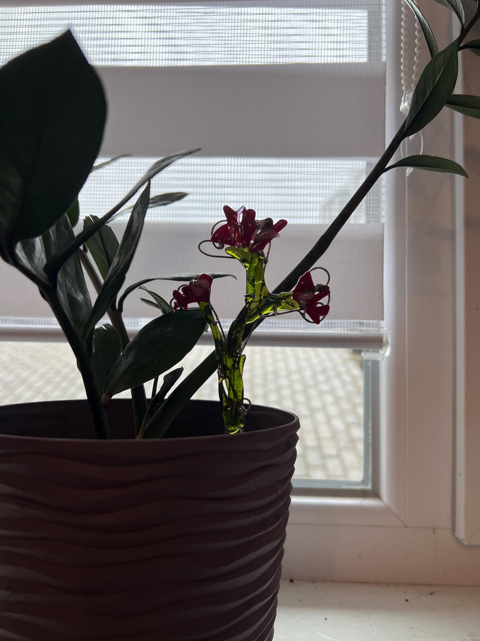 Red fused glass plant stake in green pot