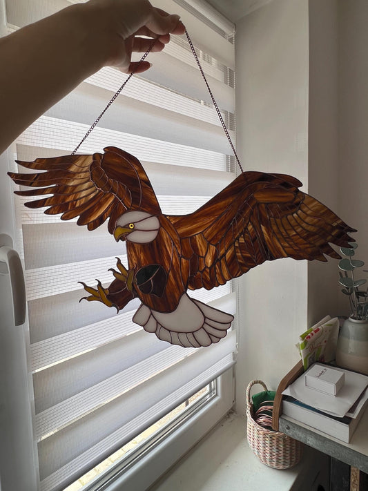 American eagle glass suncatcher hanging in window
